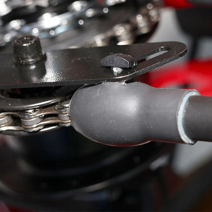 View of the black Hase Chain Tube Plastic Bracket Full Tube installed on a supporting bracket on a Hase Trike. 