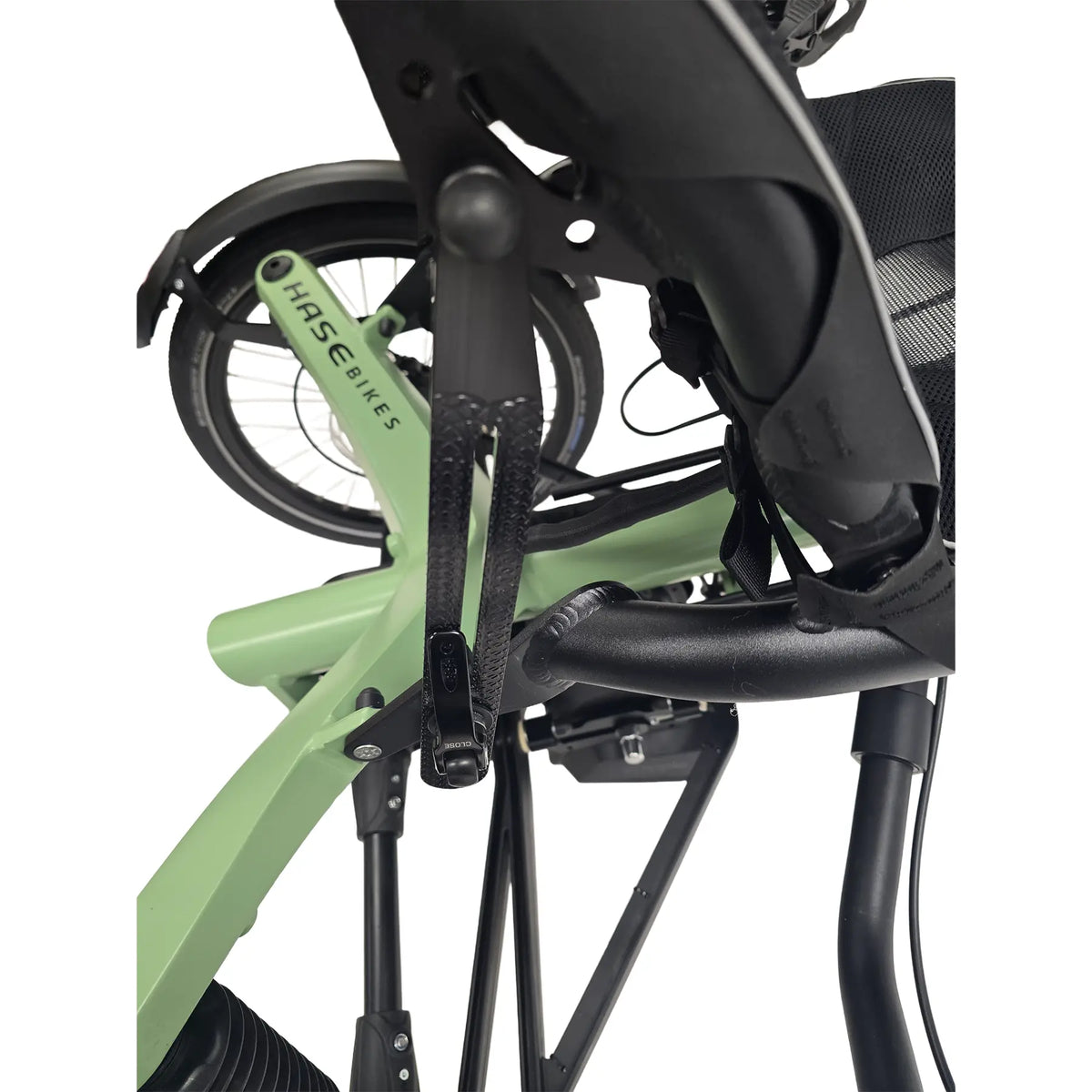 Closeup side view of the seat adjustment mechanism on the Hase Kettwiesel One Plus Enviolo Bosch Performance CX Pale Green Recumbent Trike against a white background.