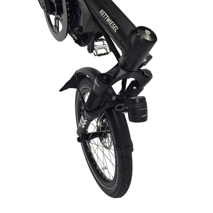 Closeup view of the headlight, fender,  front suspension and wheel on the Hase Kettwiesel One Plus Enviolo Bosch Performance CX Pale Green Recumbent Trike against a white background.
