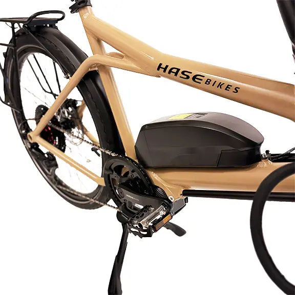 Closeup view of the battery, crankset and pedals, kickstand and frame on the Hase Pino EP6 Cargo Grey Beige Tandem Recumbent Bike against a white background.