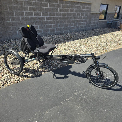 Angled side view of the Hase Used 2022 Kettwiesel Evo Steps 6100 with 630wh Battery and 2A Charger Recumbent Trike in an outdoor setting.