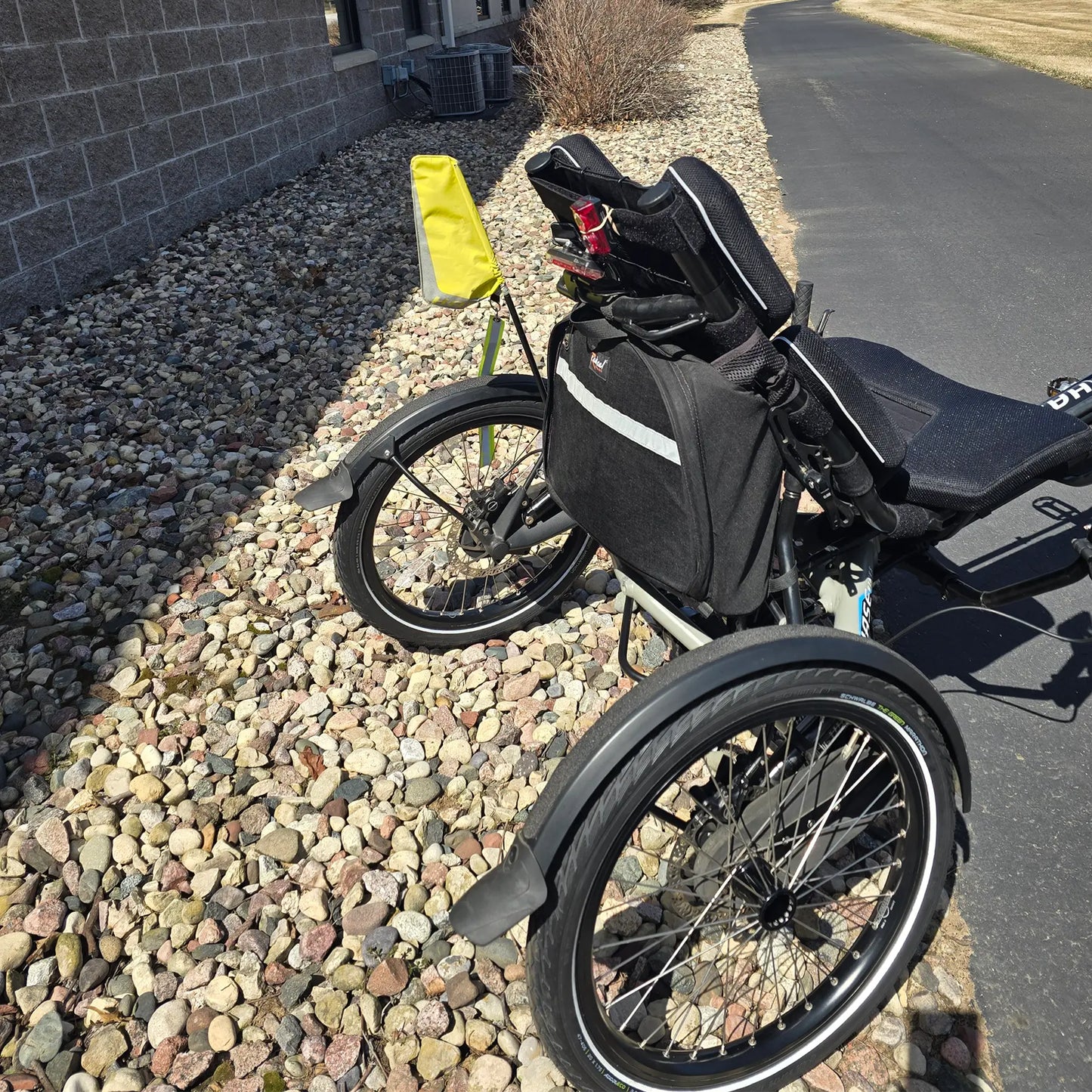 Closeup view of the back of the Hase Used 2022 Kettwiesel Evo Steps 6100 with 630wh Battery and 2A Charger Recumbent Trike in an outdoor setting.