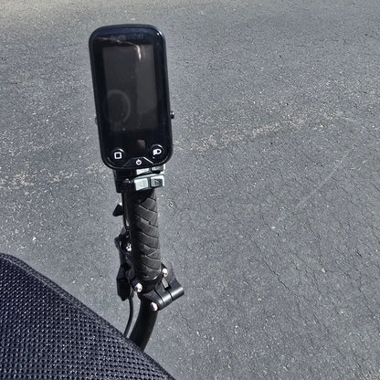 Closeup view of the handlebar and e-assist console on the Hase Used 2022 Kettwiesel Evo Steps 6100 with 630wh Battery and 2A Charger Recumbent Trike in an outdoor setting.