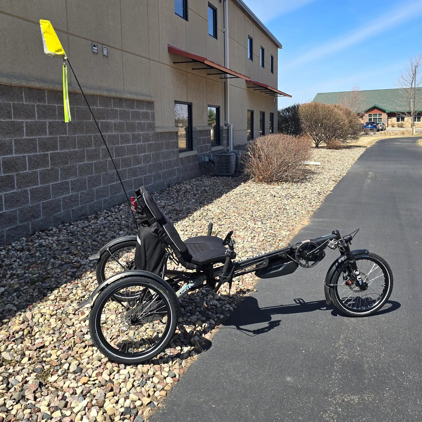 Side view of the Hase Used 2022 Kettwiesel Evo Steps 6100 with 630wh Battery and 2A Charger Recumbent Trike in an outdoor setting.