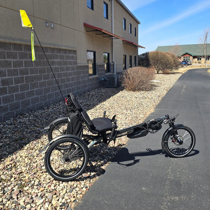 Side view of the Hase Used 2022 Kettwiesel Evo Steps 6100 with 630wh Battery and 2A Charger Recumbent Trike in an outdoor setting.