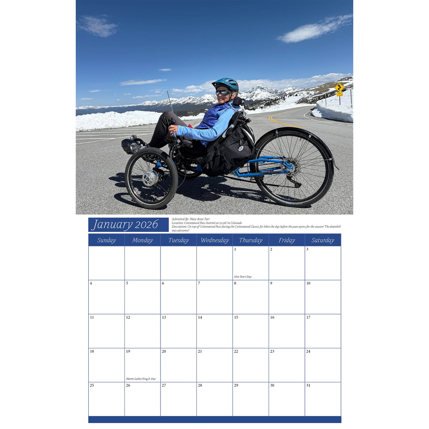 Calendar page for January 2026 showing a person on a recumbent trike in a snowy mountainous area.