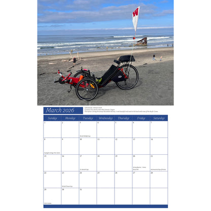 Calendar page for March 2026 with a beach scene and a recumbent trike.