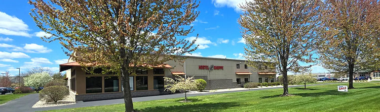 Image of the Hostel Shoppe building in spring.
