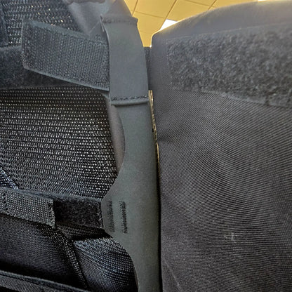 Closeup view of attachment loop and Velcro on the HP Velotechnik Add-On Bags for Mesh Seat in black mounted on a trike.