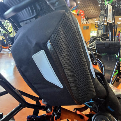 Closeup view of the mesh topped bag in the pair of the HP Velotechnik Add-On Bags for Mesh Seat in black mounted on a trike.