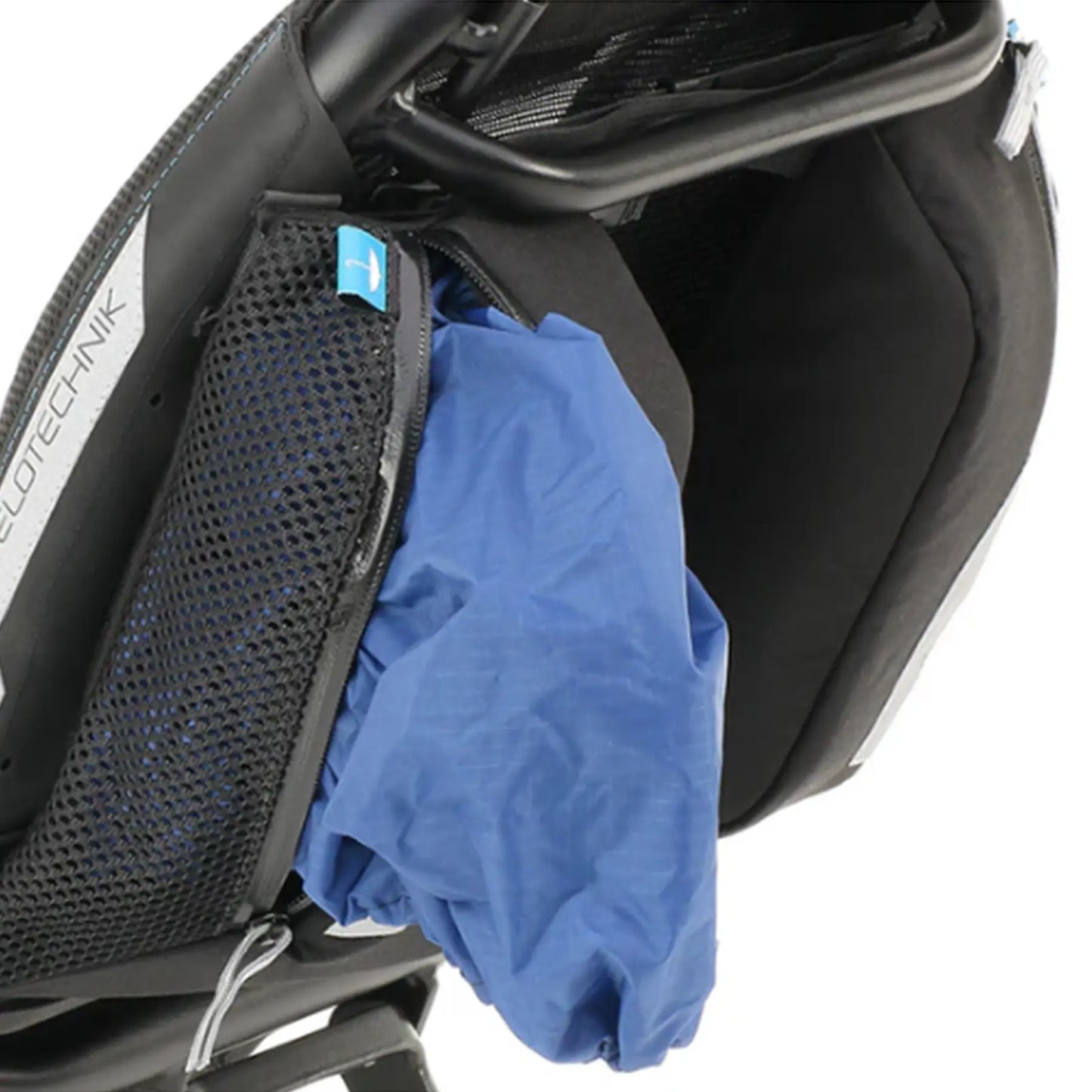 Closeup view of the mesh bag holding an optional rain cover on the HP Velotechnik Add-On Bags for Mesh Seat in black mounted on a trike.