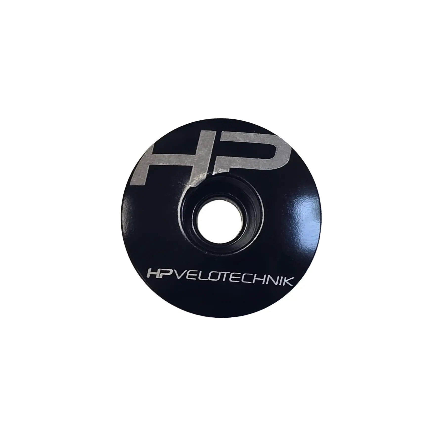Top view of the HP Velotechnik Ahead Cap in black and silver against a white background.