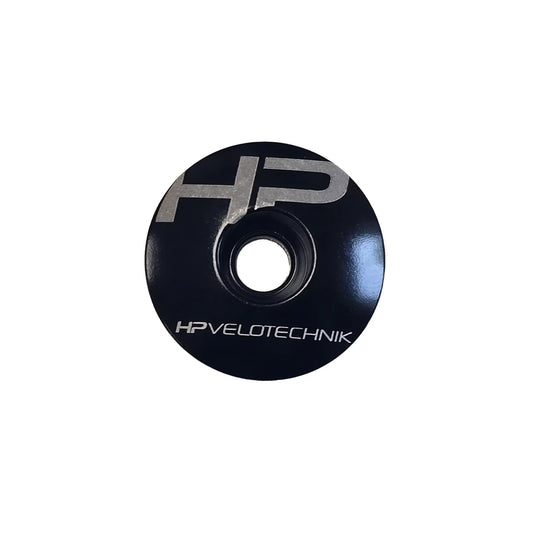Top view of the HP Velotechnik Ahead Cap in black and silver against a white background.