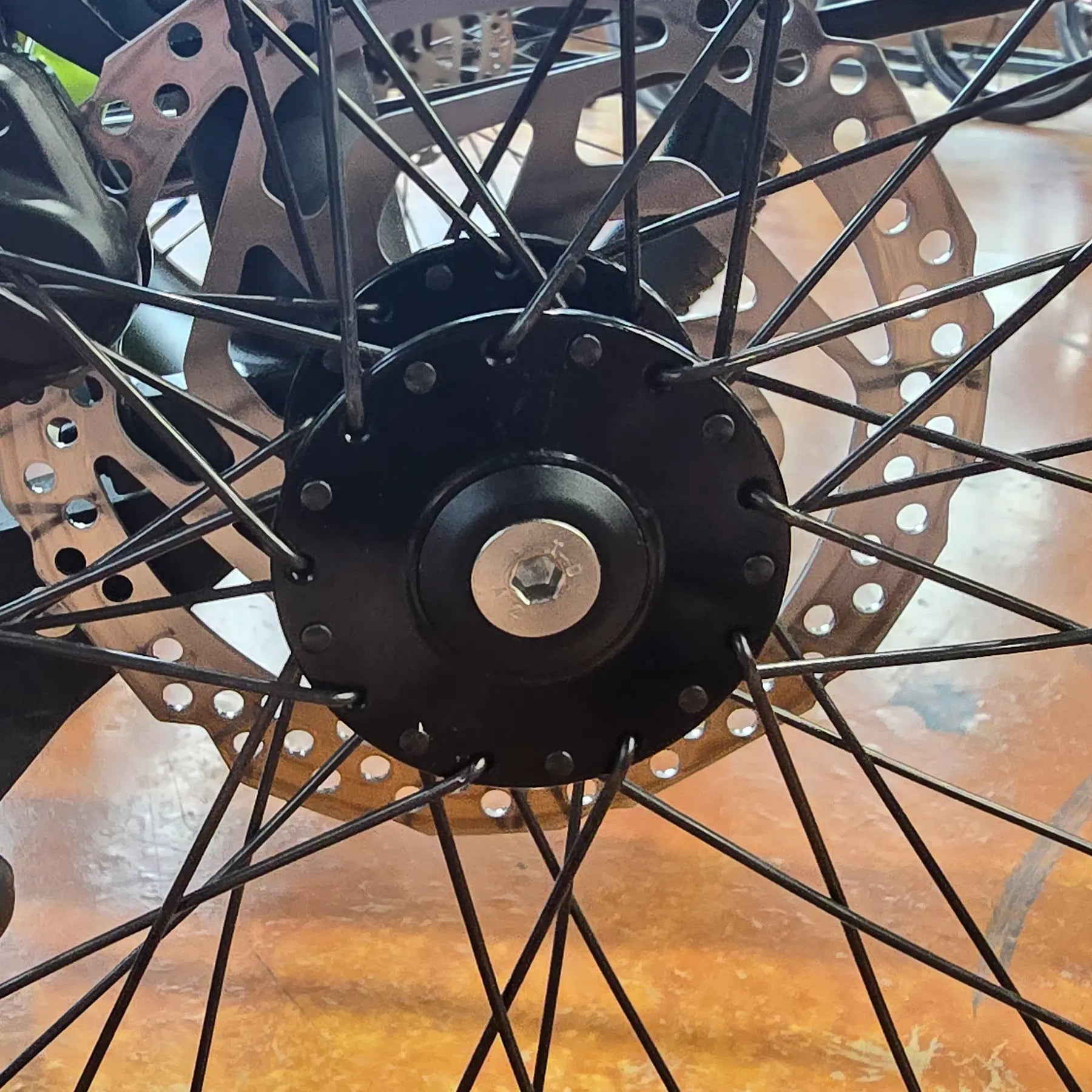 View of the HP Velotechnik Countersunk Screw for Dust Cap mounted on an HP Velotechnik trike hub.