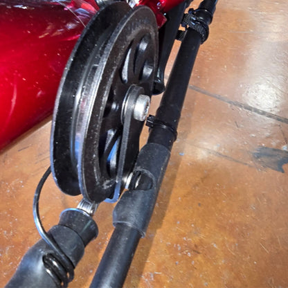 Closeup view of the black metal HP Velotechnik Gekko Chain Catch Hook installed on a trike.