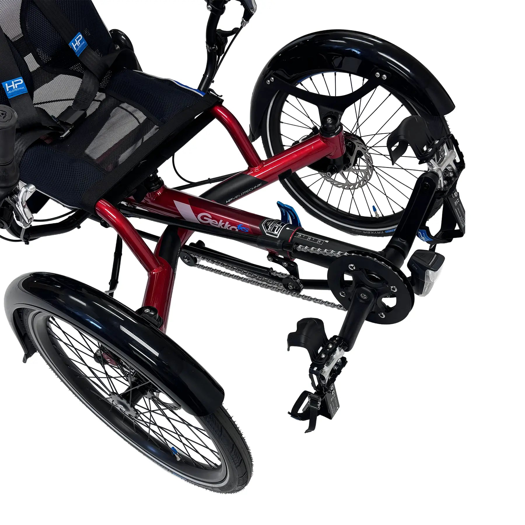 Closeup front view of the HP Velotechnik Gekko fxs Magma Red Recumbent Trike with Accessories against a white background.