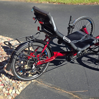 Rear view of the HP Velotechnik Used Gekko fx 20 Recumbent Trike in Magma Red in an outdoor setting.