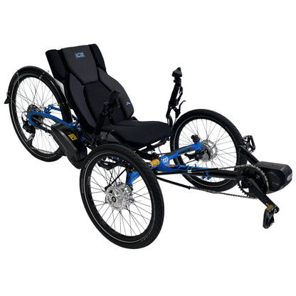 Angled side view of the ICE Adventure 26 RS Shimano STEPS EP801 Compact Blue Recumbent Trike against a white background.