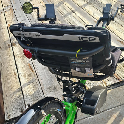 Closeup rear view of the ICE Adventure HD 26 FS PERS Chainless Kiwi Green Recumbent Trike on a bike path.