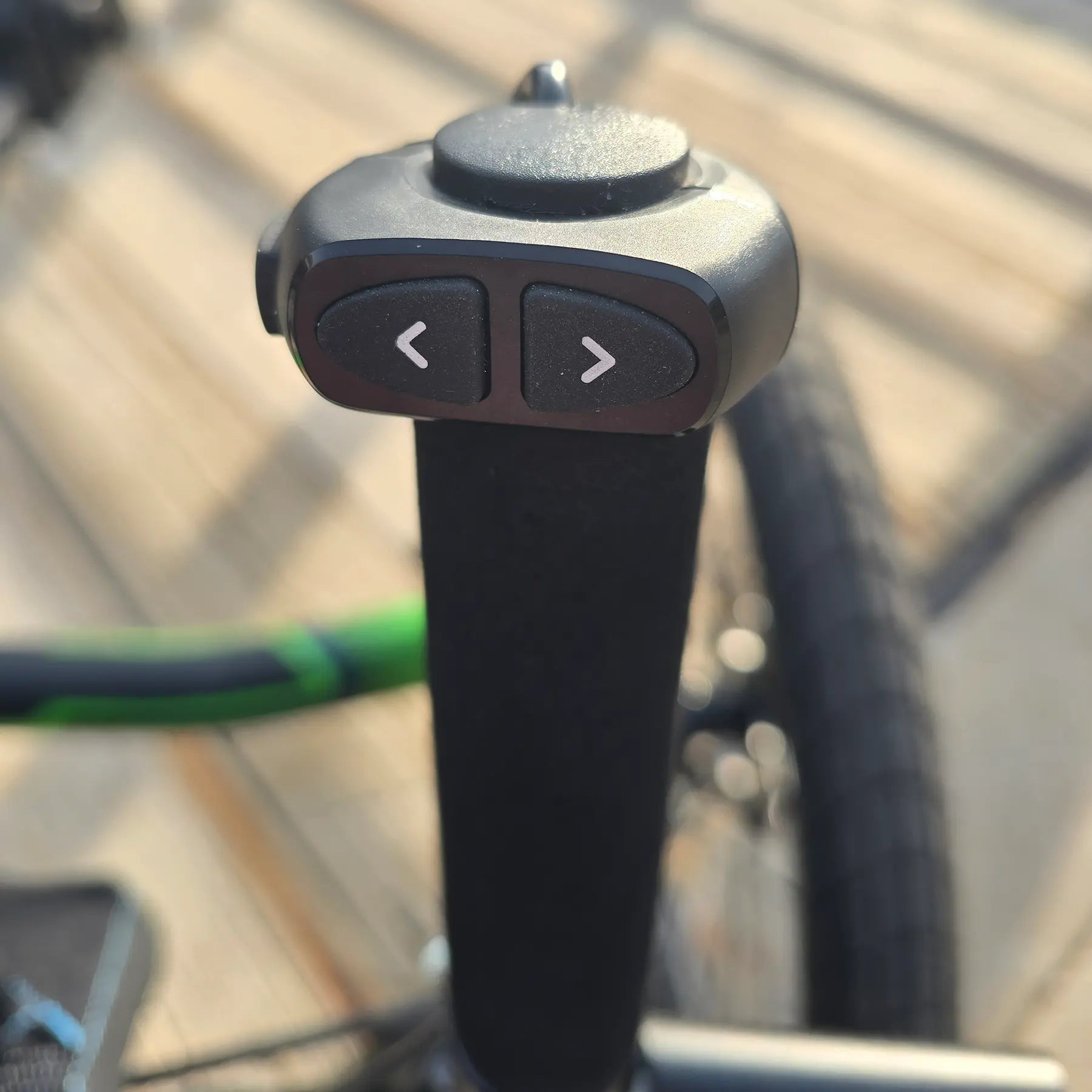 Closeup view of the cadence adjuster on the ICE Adventure HD 26 FS PERS Chainless Kiwi Green Recumbent Trike on a bike path.