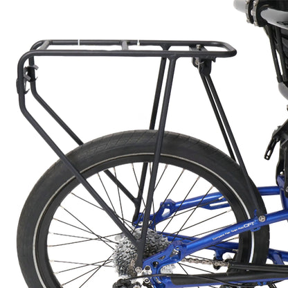 Side view of the ICE 20 Inch Rigid Rear Rack in black mounted on a blue trike against a white background.