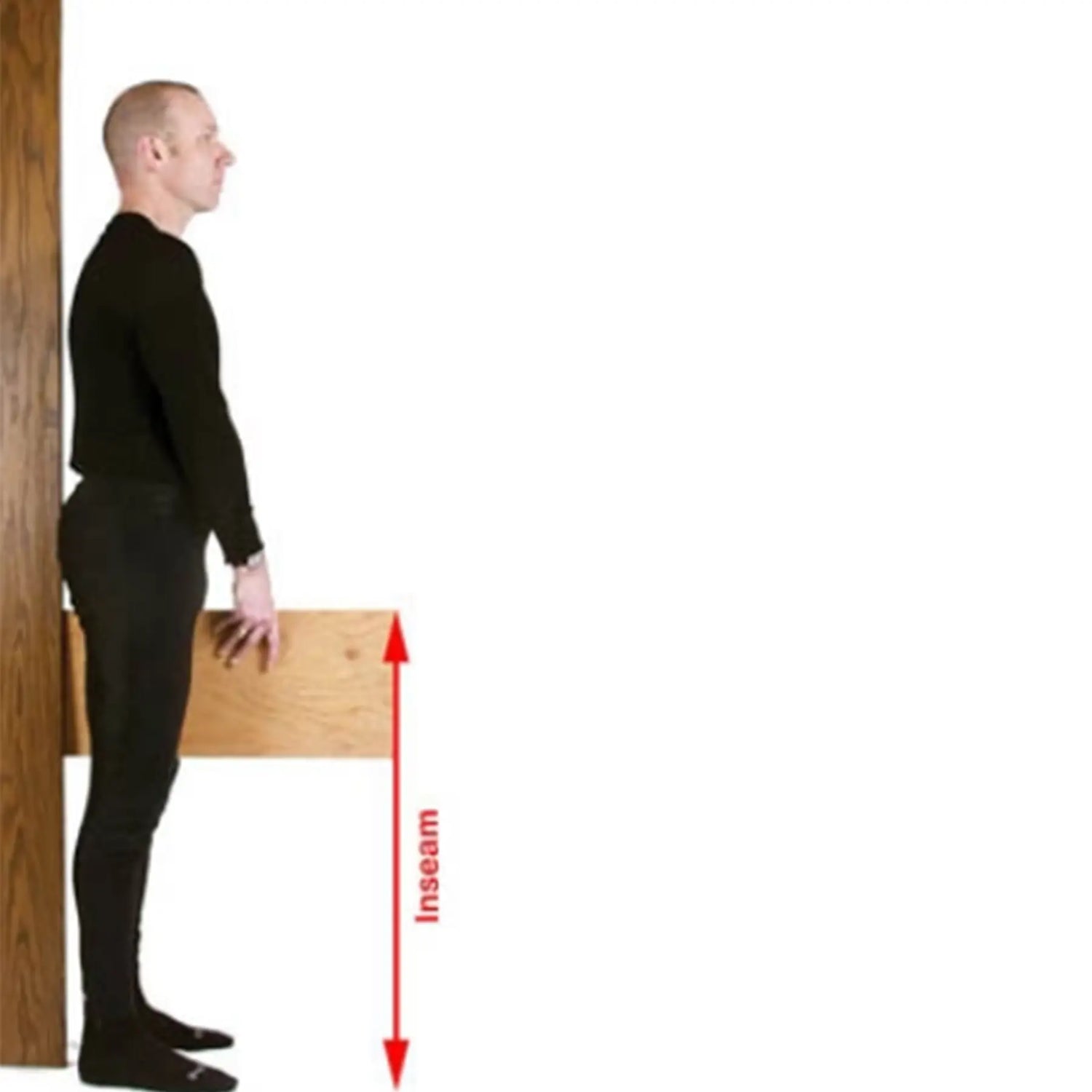 Person standing next to a wooden board with an arrow labeled 'Inseam' pointing downwards.