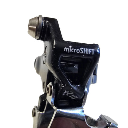 Closeup view of the top of the microShift Take Off R10 2 x 10 Speed Bottom Swing Down Pull Front Derailleur against a white background.