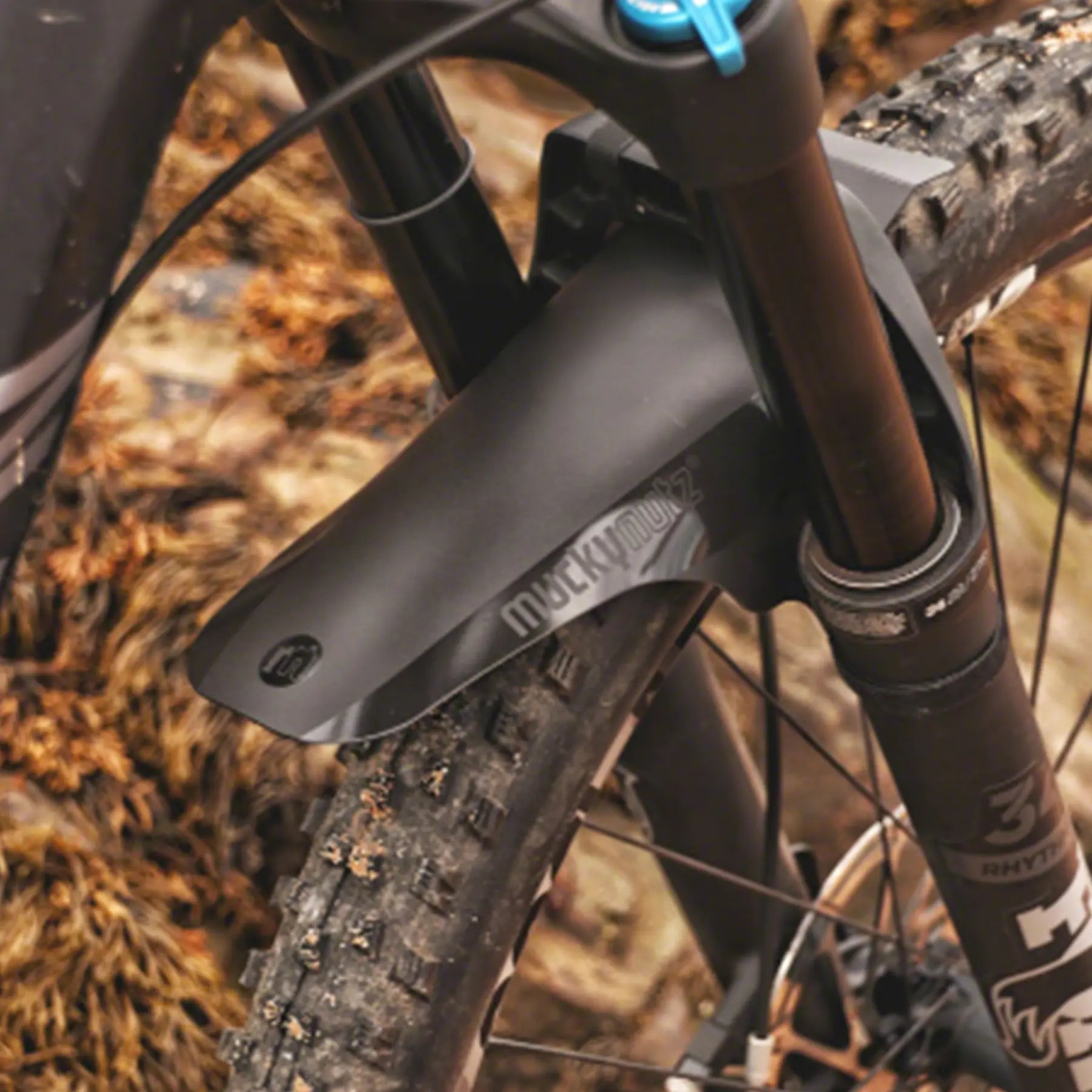 Image of the Mucky Nutz Black Face Fender installed on a mountain bike with front suspension.