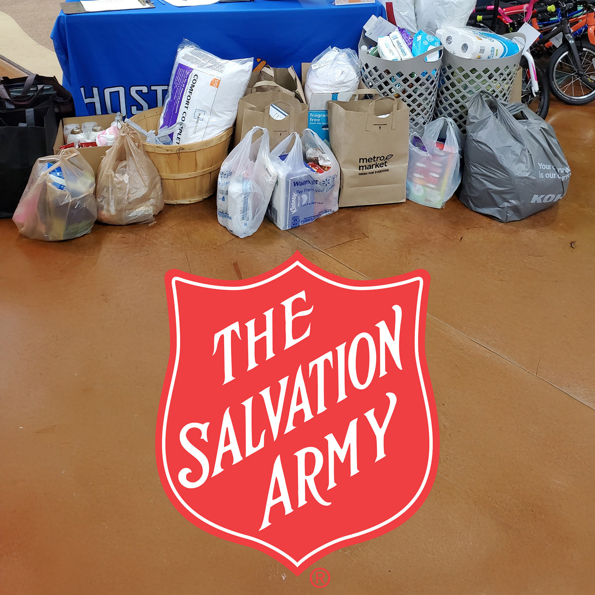 Collection of donated items on a table with The Salvation Army logo.