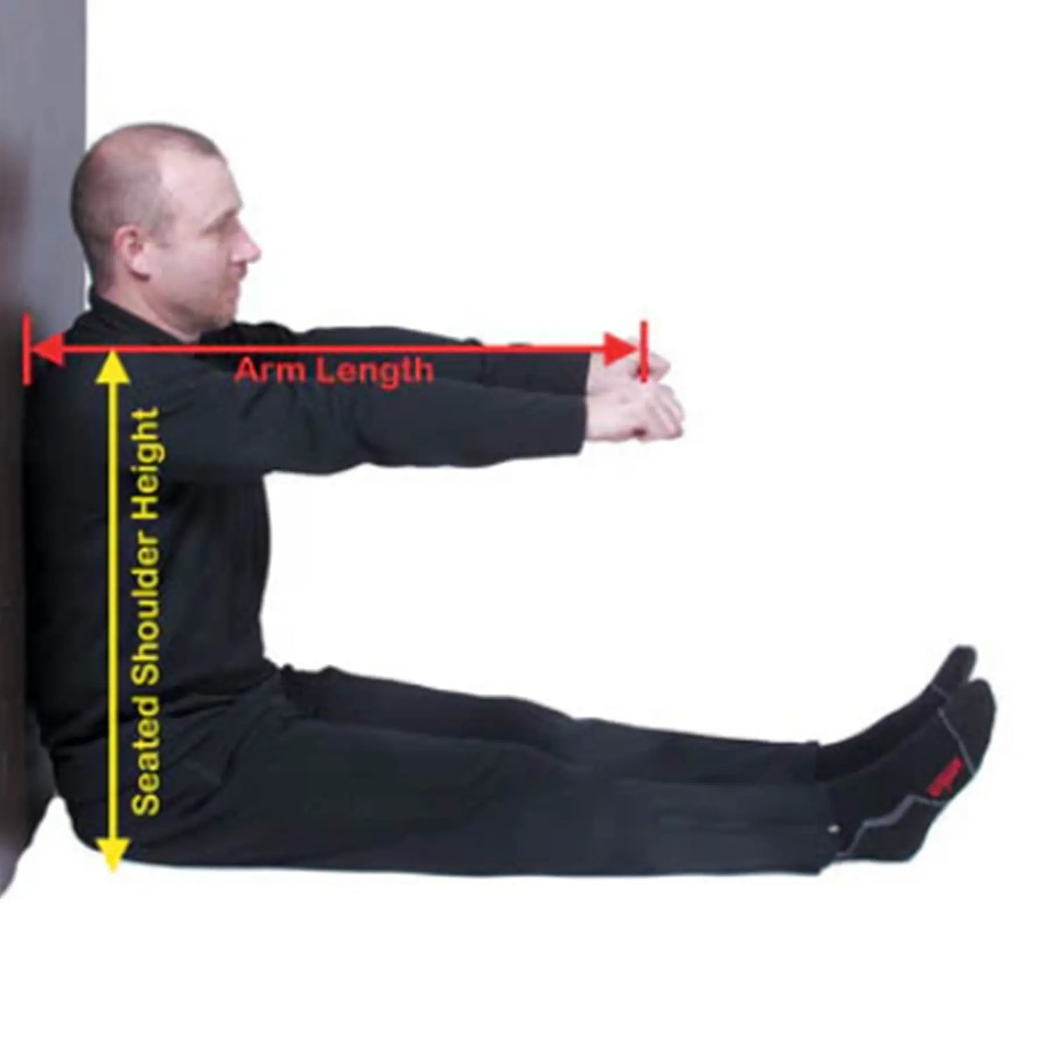 Person demonstrating arm length and seated shoulder height measurements against a white background