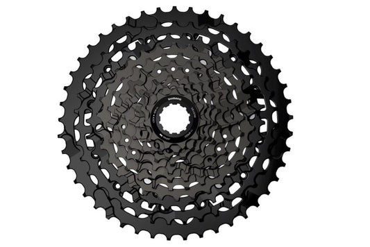 Top view of black Shimano CUES CS-LG700 cassette on white background. 