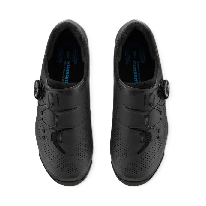 A pair of black Shimano SH-XC302 cycling shoes with Boa dial-up closures, shown from a top-down view on a white background.