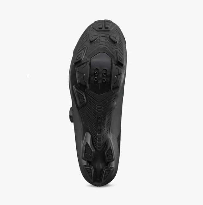 Black Shimano SH-XC320 cycling shoe shoe sole on a white background