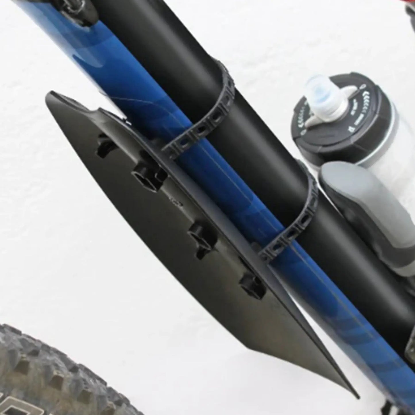 Image of the SKS X-Mud Downtube Fender mounted on a blue bicycle frame downtube.