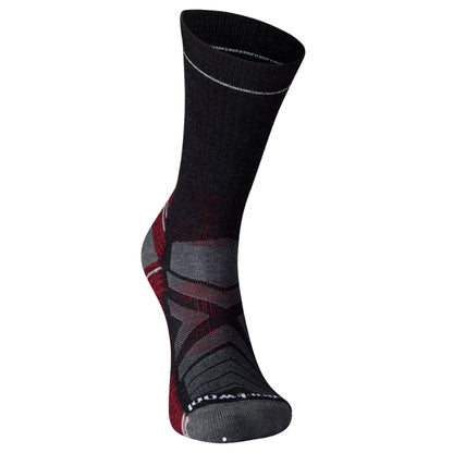Front view of a black, red, and gray hiking sock with a Smartwool logo against a white background.