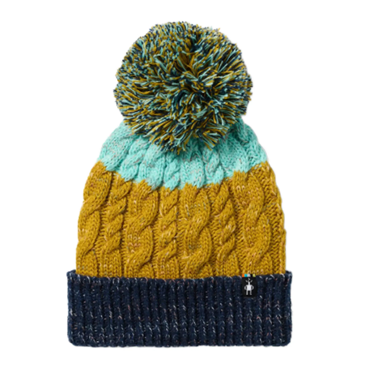 A cable-knit Smartwool Isto Retro Beanie in Broze Olive Heather featuring a mustard yellow body, a light blue-green top band, a navy blue ribbed cuff, and a large pom-pom in a marled mix of yellow, blue, and green.