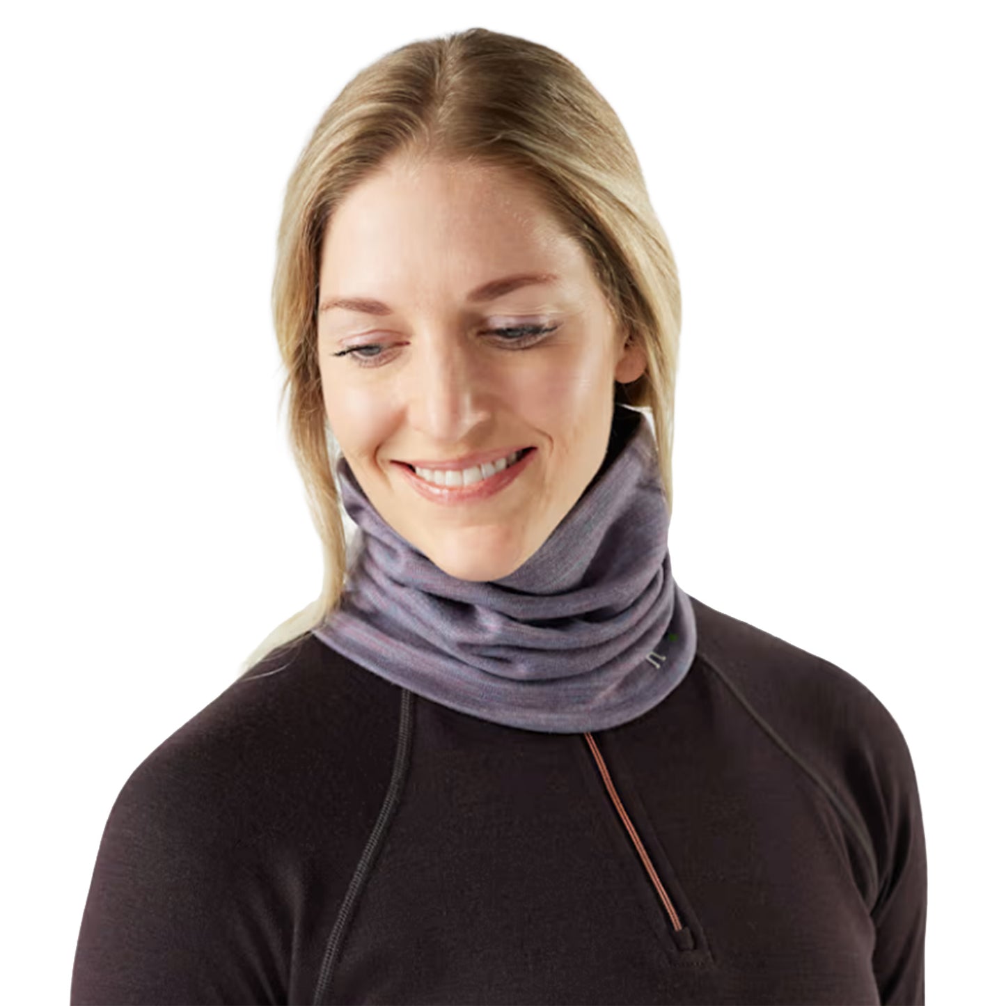 A woman wearing the Smartwool Thermal Merino Reversible Pattern Neck Gaiter in Chalk Violet Heather against a white background.