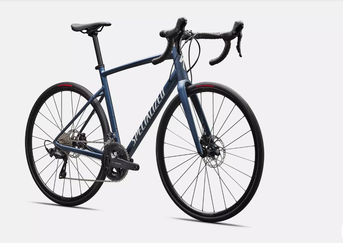 Front angled view of blue Specialized Allez e5 road bicycle on a white background