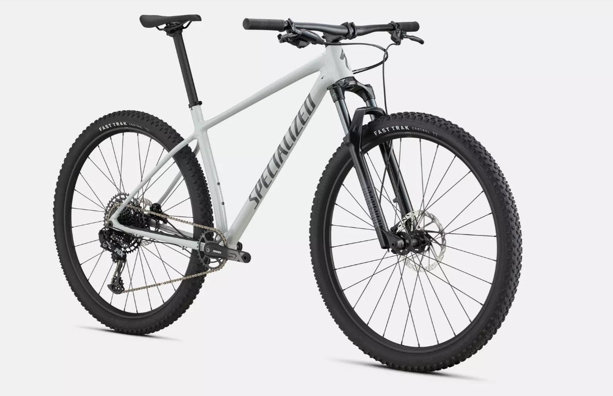 Front right angle of white Specialized Chisel mountain bike with black components on a light gray background.