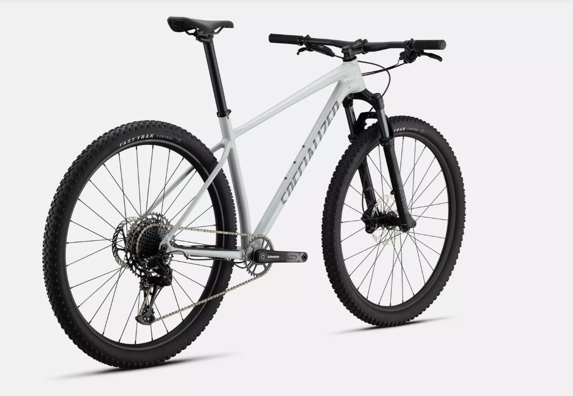 Back right angled view of white Specialized Chisel mountain bike on a white background.