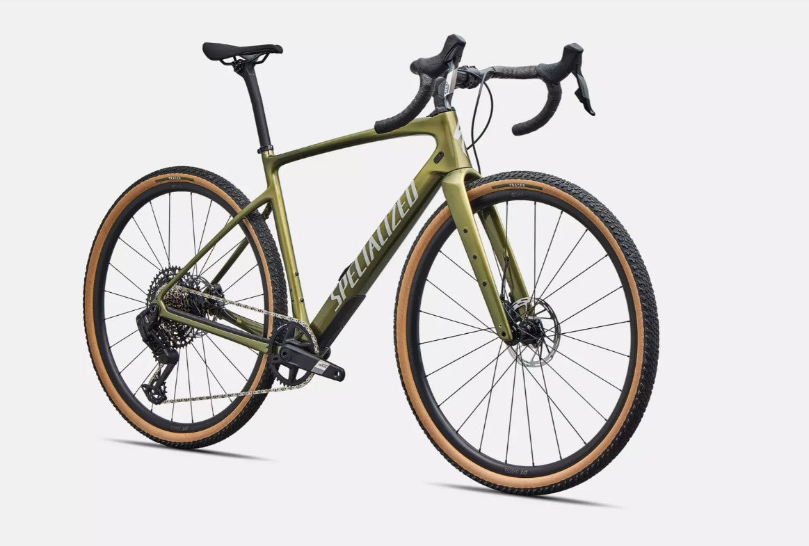 Front right profile of green Specialized Diverge Comp road bicycle with brown sidewall tires on a white background.