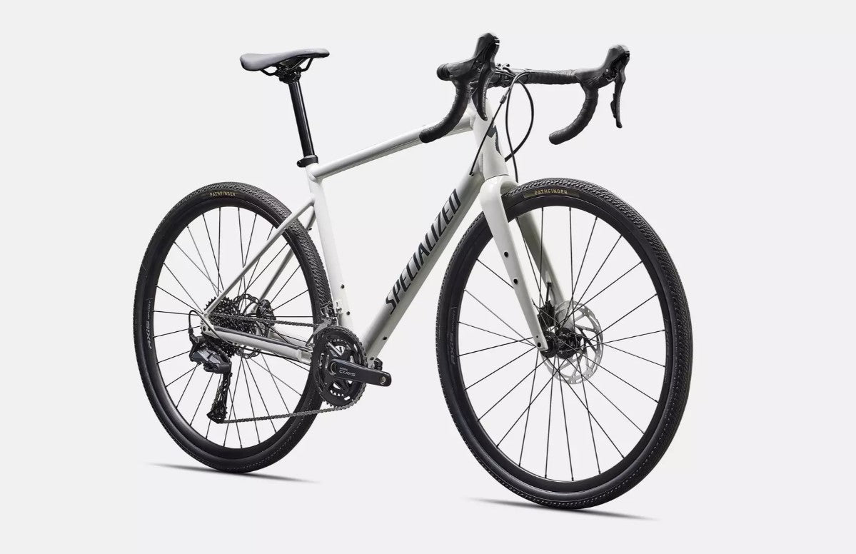 Front right profile of a white Specialized Diverge e5 road bicycle with black components on a white background