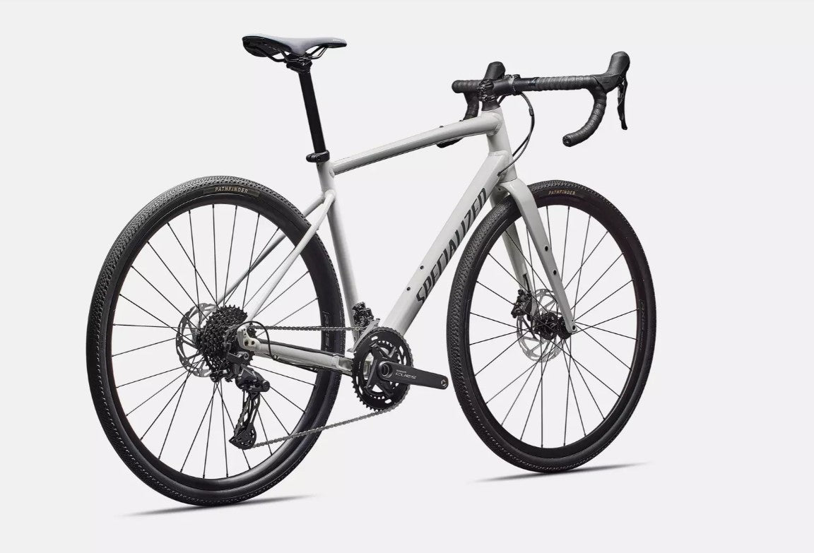 Back right profile view of a white Specialized Diverge e5 road bicycle with black components on a white background.