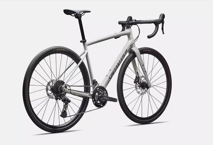 Back right profile view of a white Specialized Diverge e5 road bicycle with black components on a white background.