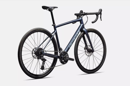 Back right profile view of blue Specialized Diverge e5 road bicycle on white background.