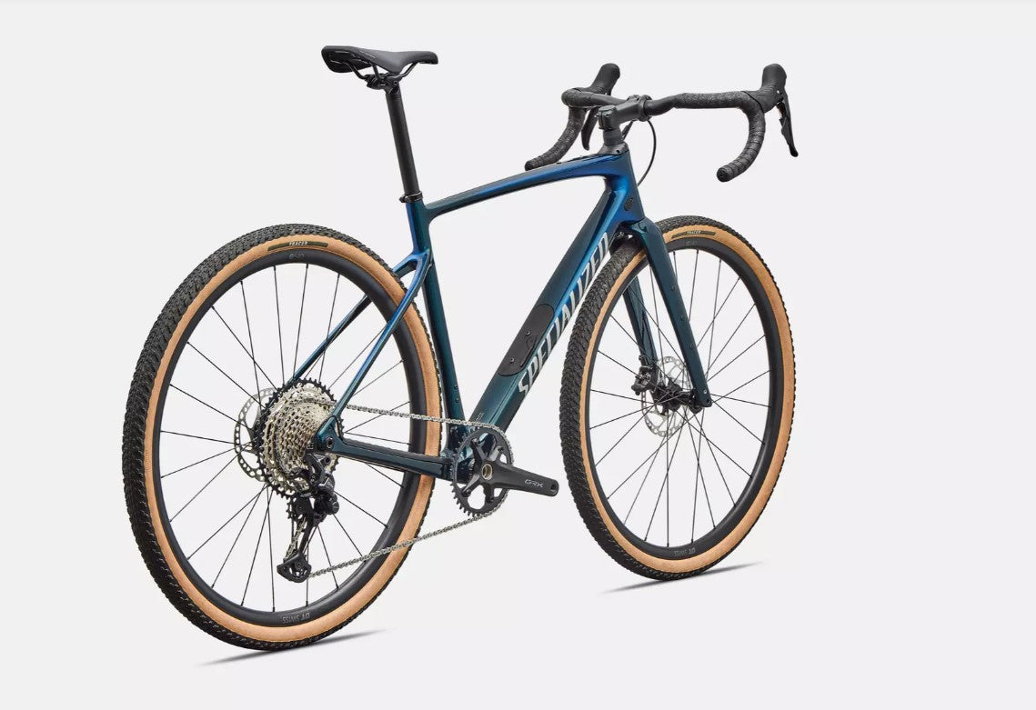 Back right profile view of blue Specialized Diverge Sport road bicycle with brown sidewall tires on a white background.