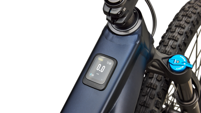 Close-up of a blue Specialized Levo R Comp Alloy electric assist mountain bike with a digital display screen, a black front fork, and part of the front tire against a white background.
