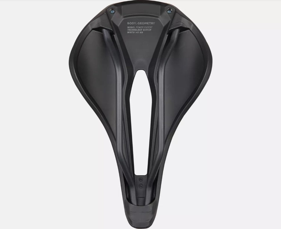 Bottom view of black Specialized Power Expert bicycle saddle on a white background. 