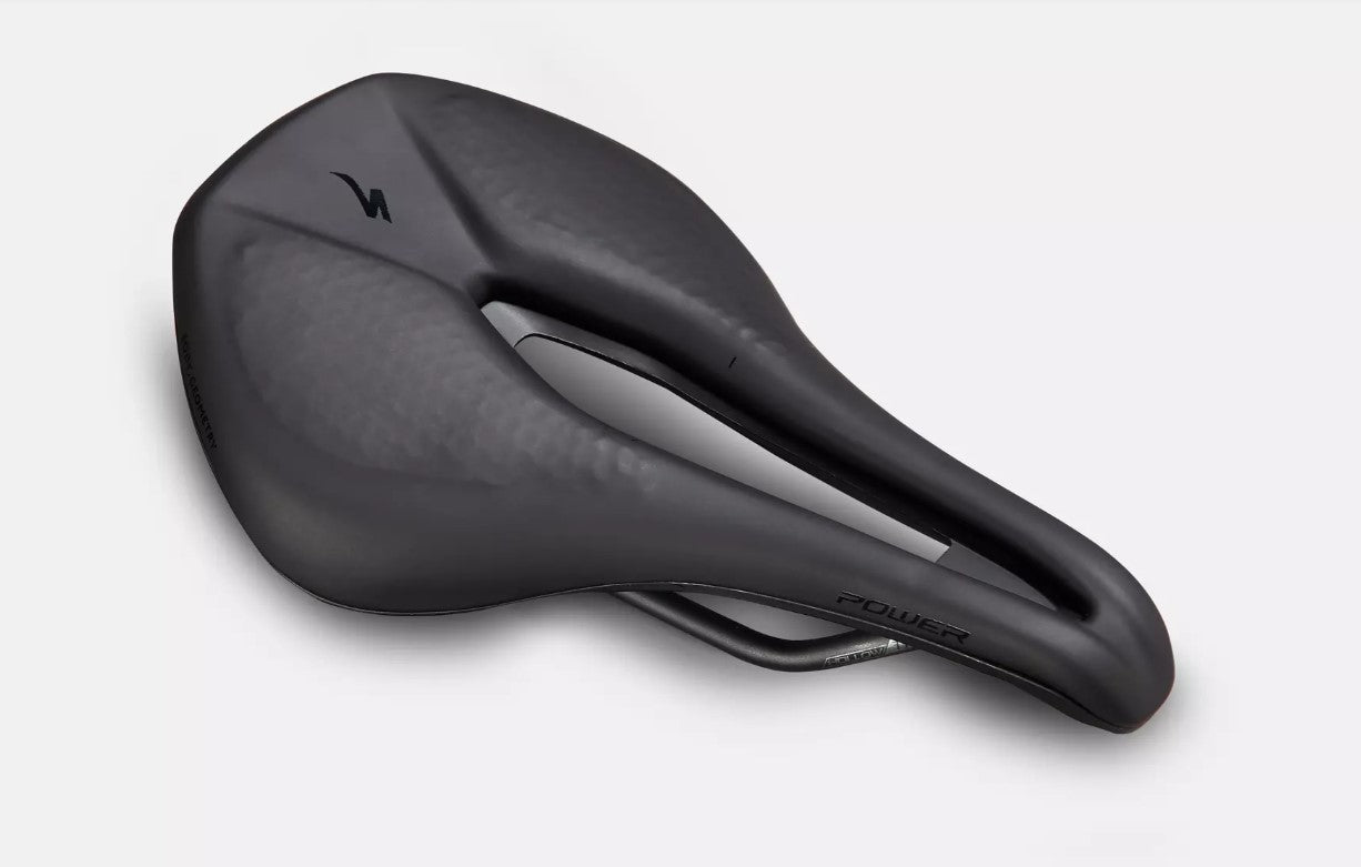 Angled top down view of black Specialized Power Expert bicycle saddle on a white background. 