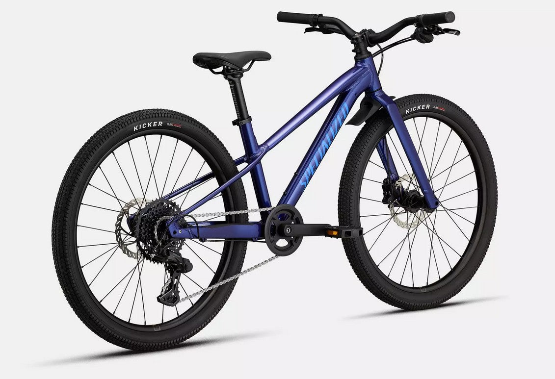 Back right angled profile view of a blue Specialized Riprock kids mountain bike with black components on a white background. 